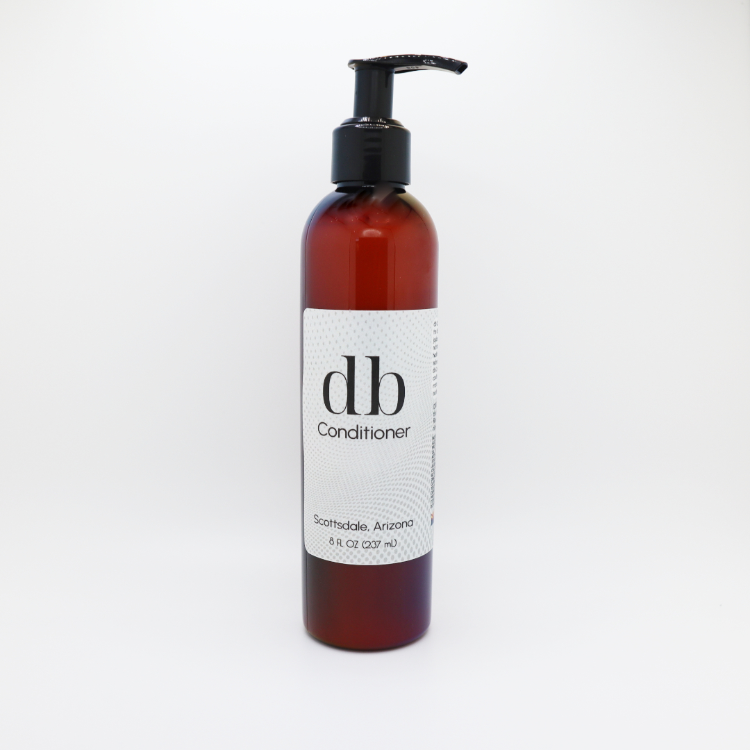 Photo of db Conditioner in an amber pump bottle