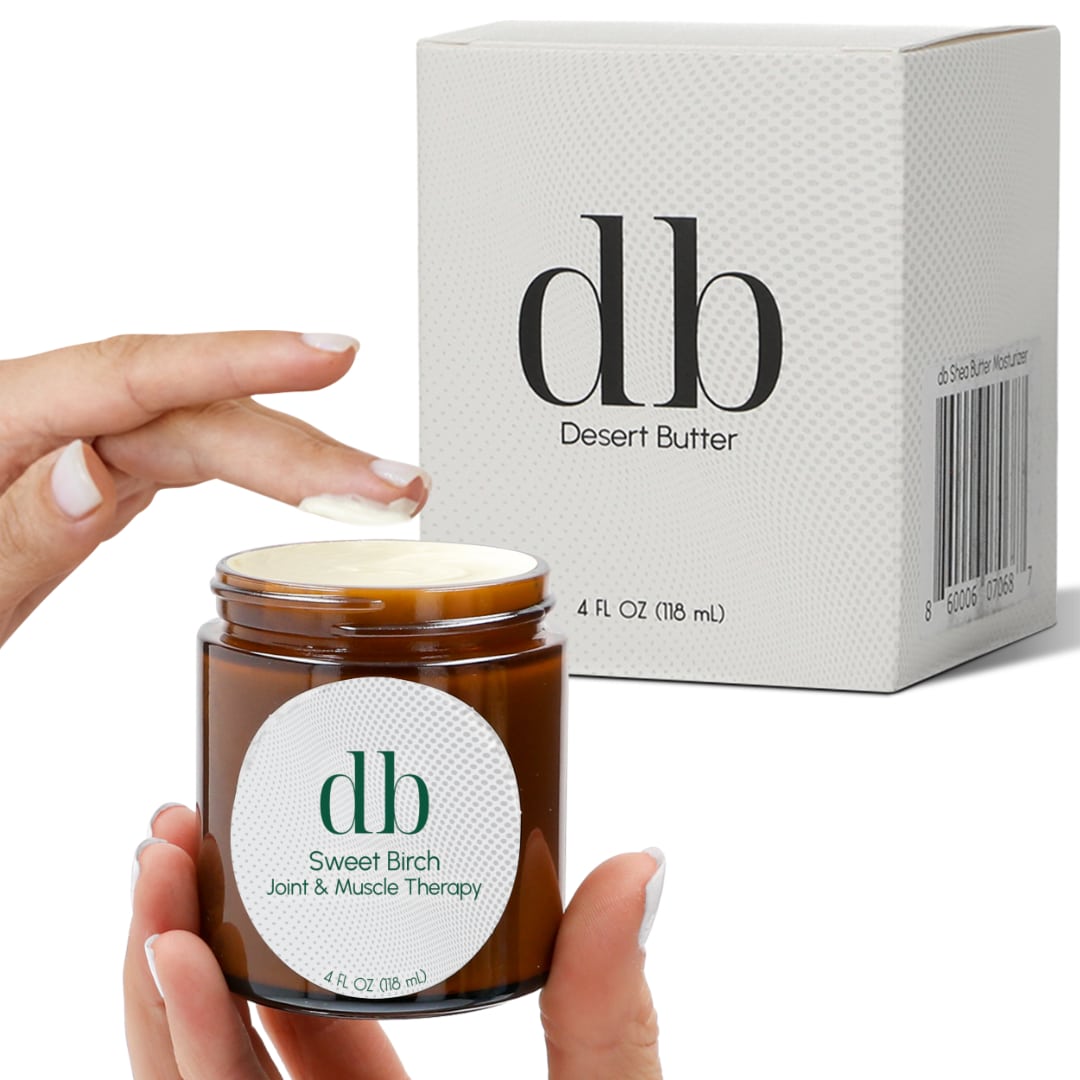 Image of woman dipping finger into jar of db Sweet Birch Body Butter